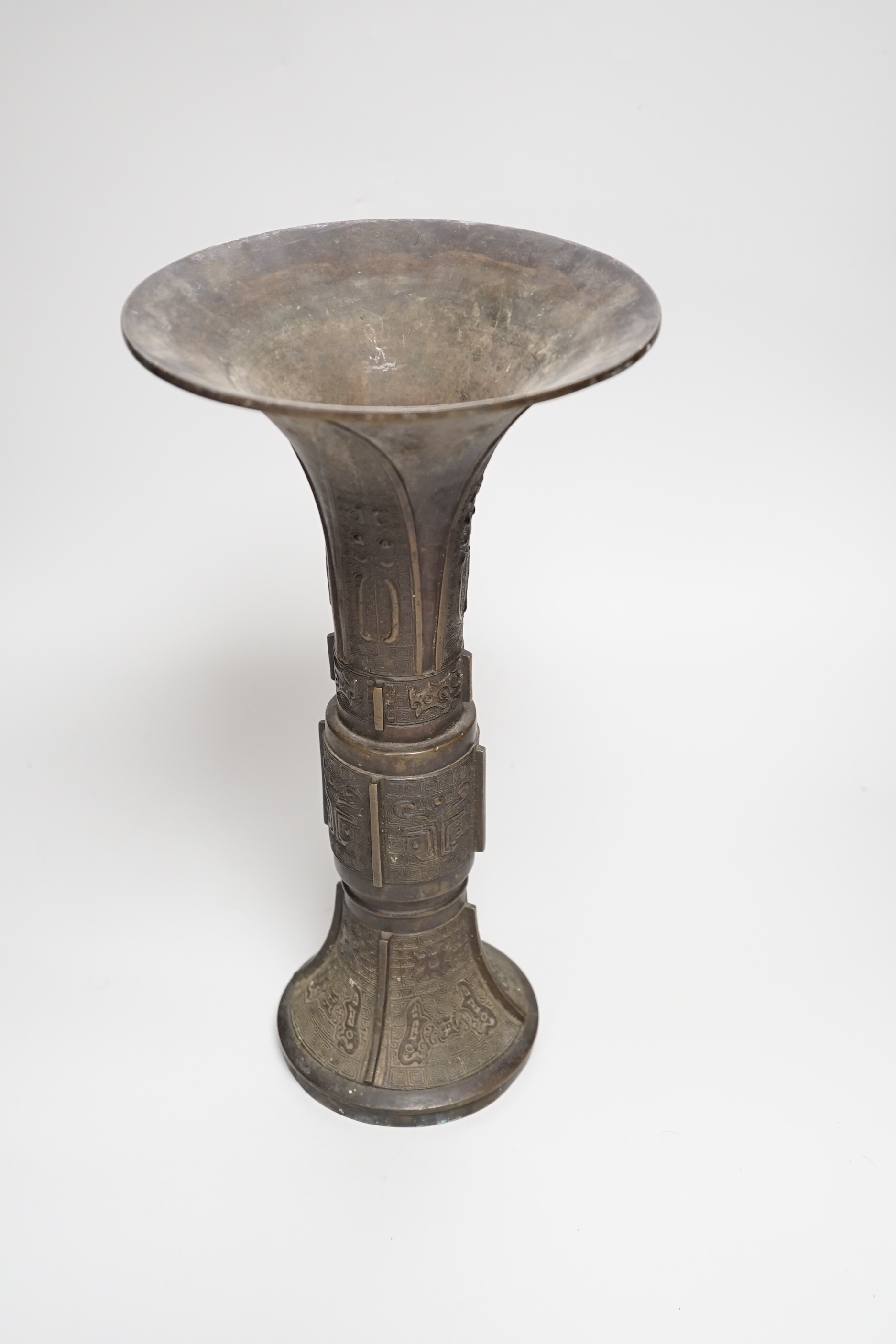 An 18th/19th century Chinese archaistic bronze beaker vase, gu, 34cm high